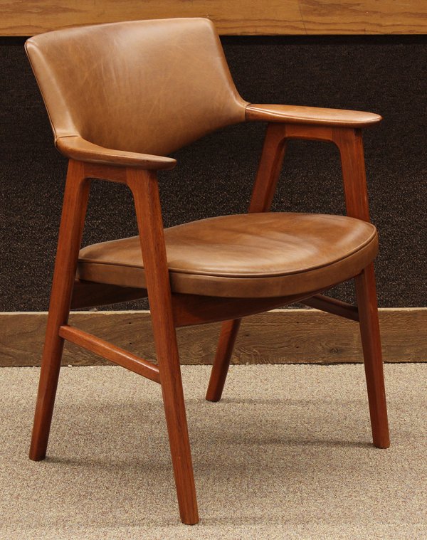 Eric Kirkegaard arm chair: Danish Modern armchair executed by Eric Kirkegaard, upholstered in cocoa leather and having a continuous teak frame rising on tapered legs, 32.5''h x 24.5''w