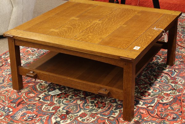 Stickley Arts and Crafts low table: Arts and Crafts style low table, executed by Stickley / E.J. Audi in quarter sawn oak, the plank top with butterfly joinery above the tiered base having keyed thru tenons and rising on square legs, re