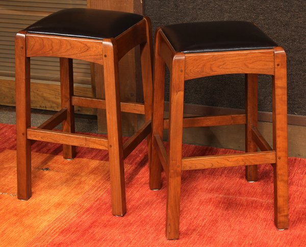 Arts and Crafts stools: Pair of Arts and Crafts style stools executed in cherry by Stickley/E.J Audi, having a leather drop in seat and rising on square legs, retains plaque, 25''h x 14'' square