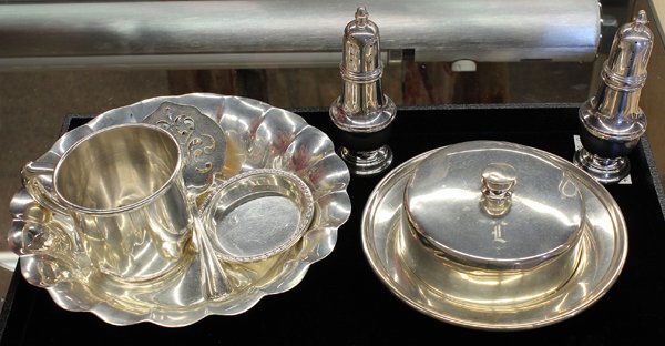 American sterling silver table items: (Lot of 7) American sterling silver table accessories including a Towle organic form bowl, SSMC covered butter, Manchester Silver Co. baby cup, Genova salt and pepper cellars, 20.06 troy oz.