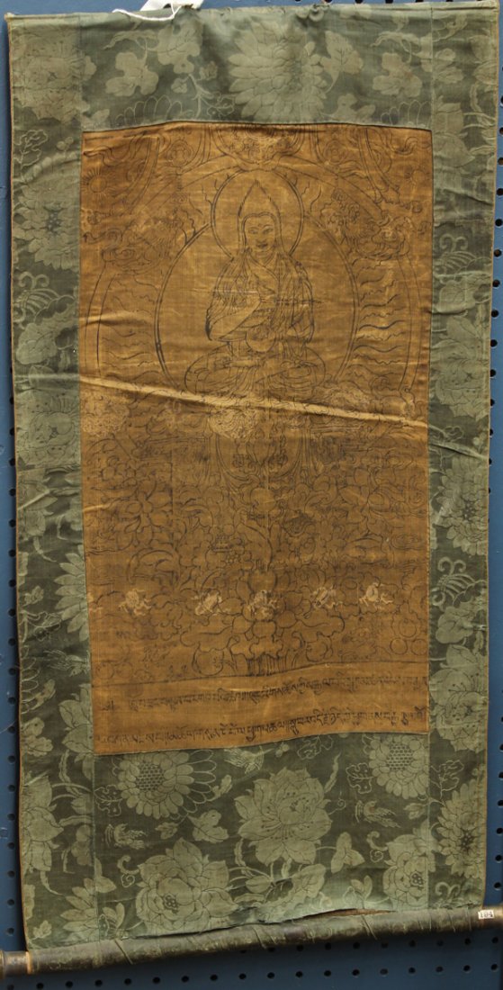 Himalayan/Tibetan Thangka, Buddhist Patriarch: Himalayan painted thangka, ink on silk, 19th/early 20th century, featuring a Buddhist patriarch seated on a lotus throne issuing from lotus sprigs, above two rows of Tibetan text, overall: 31''h x 16.