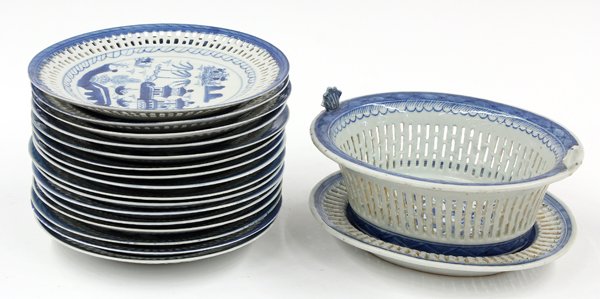 Chinese Pierced Export Canton Blue-and-White Porc: (Lot of 18) Chinese reticulated export Canton blue-and-white porcelain, 19th century, consisting of an openwork fruit basket and underdish, each centered with a lakeside scene, together with sixteen e