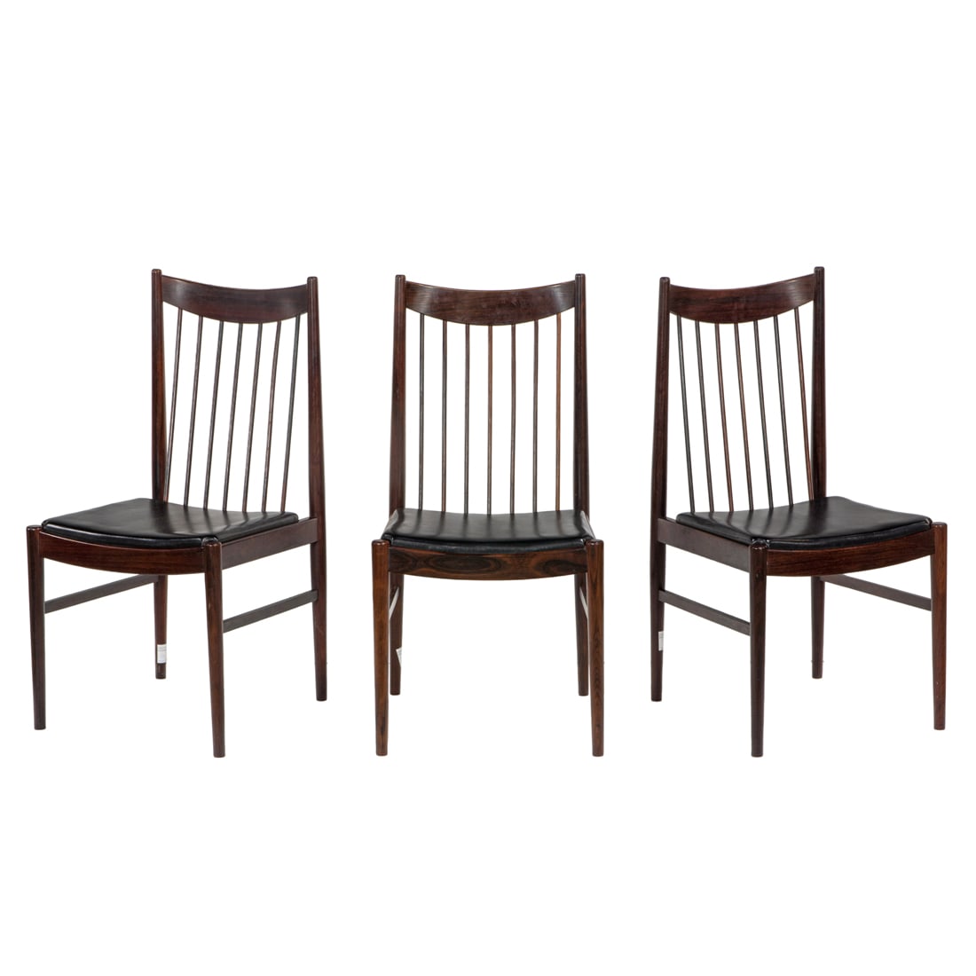 A suite of three Arne Vodder for Sibast rosewood arm chairs with spindle backs: A suite of three Arne Vodder for Sibast rosewood arm chairs with spindle backs and black leather, 38.25"h x 20.25"w x 19"w