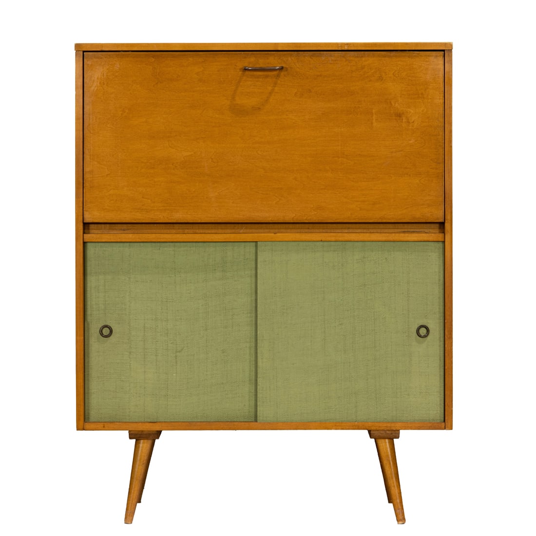 A Paul McCobb for Planner Group maple desk cabinet: A Paul McCobb for Planner Group maple desk cabinet, a drop front opening to reveal a bay of three short drawers, over green grass cloth sliding doors, 46"h x 36"w x 15.5"d