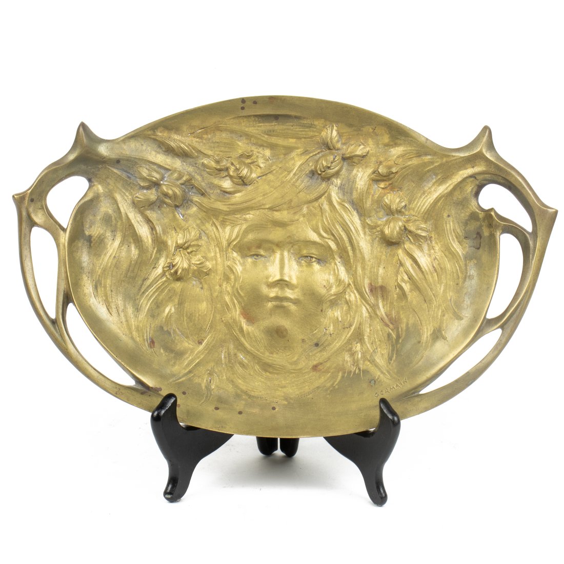 An Art Nouveau gilt bronze figural tray after Jean-Baptiste Germain: An Art Nouveau gilt bronze figural tray after Jean-Baptiste Germain, early 20th century, modeled as a nymph among iris blossoms, incised signature, 13.5"l (btw handles). Provenance: Property from the