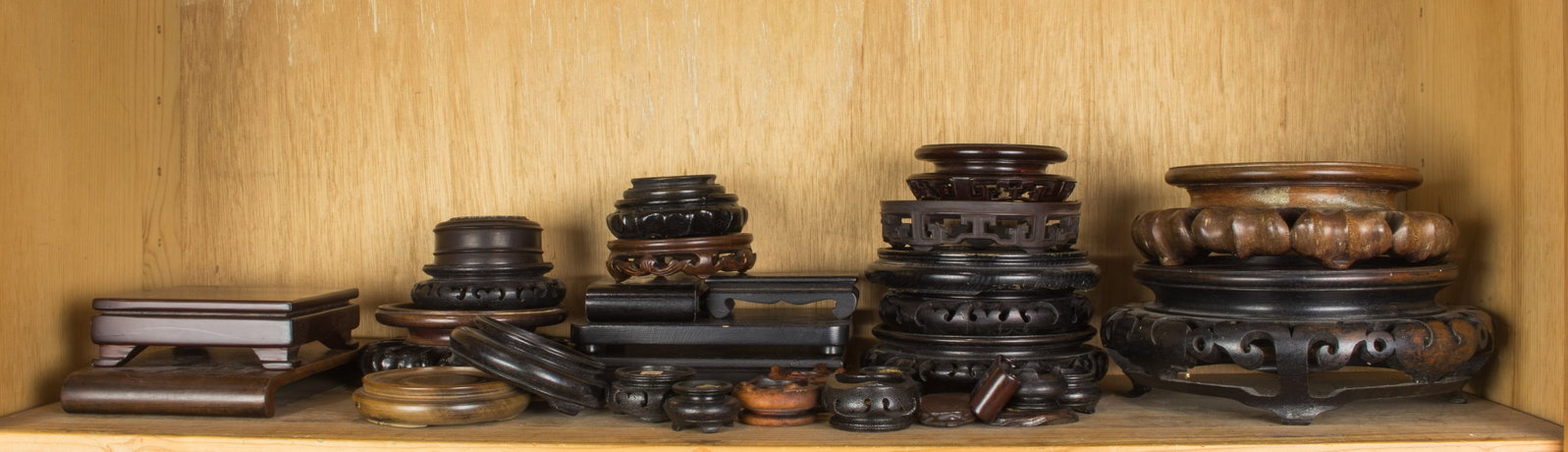 Shelf of Chinese wood display stands: Shelf of Chinese wood display stands. 9" widest.