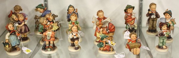 Hummels: (lot of 18) Hummels including ''Hello'' ''Latest News'' ''Visiting An Invalid'' ''Lost Stocking'' ''Mother's Helper'' ''To Market'' ''Doll Mother'' ''The Lost Sheep'' ''Telling Her Secret'' mostly 5th