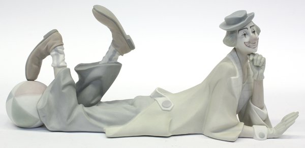 Lladro figure of a Clown: Lladro figure of a clown, the funny man reclining on his stomach and kicking a ball, 14.5''l