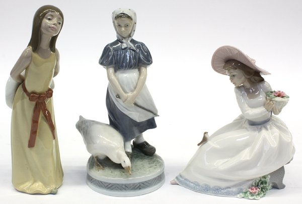 Lladro Porcelain Figures: (lot of 3) Lladro porcelain figures including a young lady with umbrella, a young lady with umbrella and dog, and a young lady holding a basket of flowers, 10''h