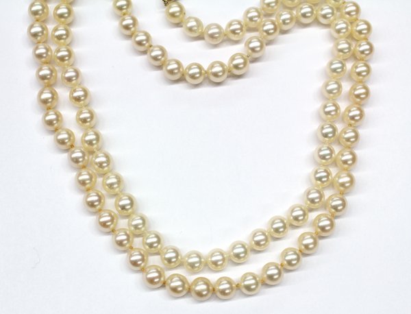 32'' saltwater cultured pearl strand with 14K cla: Lady's uniform saltwater cultured pearl strand-style necklace; mounted with 14K (stamped ''14K'') yellow gold filigree fish hook clasp and consisting of (96) spherical drilled saltwater cultured pearl