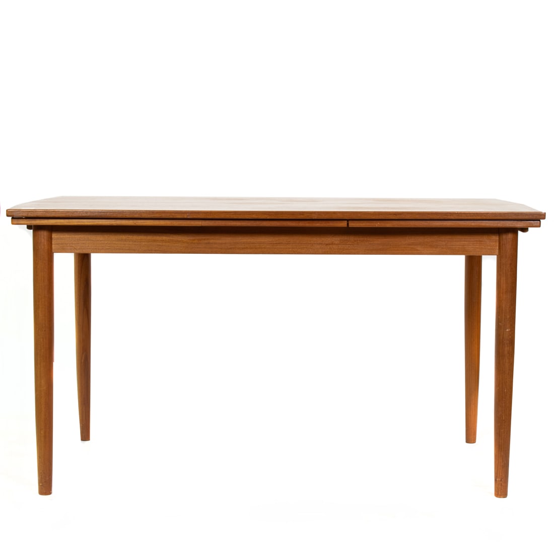 A Danish Korup Stolefabrik teak extension dining table: Korup Stolefabrik, dining table Denmark, teak, probably Kai Kristiansen design, extenension, branded "KS", 29"h x 54.5"w x 33.5"d, overall extended 29"h x 91.5"w x 34.75"d