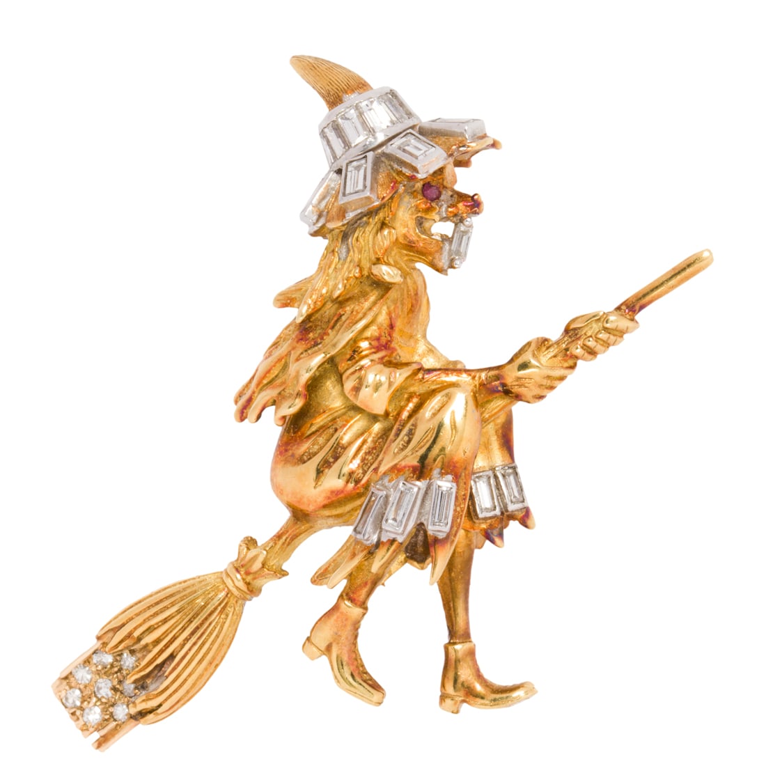 A diamond and 18k gold witch brooch: A diamond and 18k gold witch brooch set with baguette and single-cut diamonds and a ruby eye; estimated total diamond weight: 0.90 carat; 13.69 dwt; measuring 2 x 3 /8 in