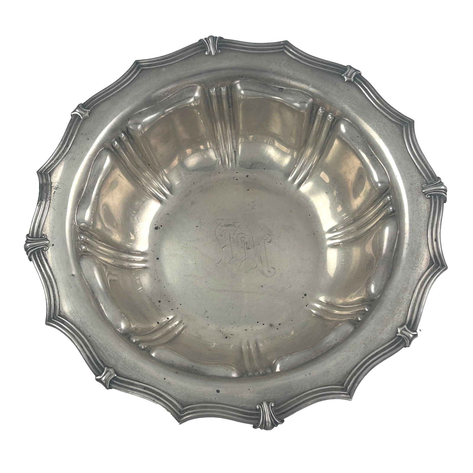 Three sterling serving bowls: a Victorian bowl by Stephen Smith and William Nicholson: Three sterling serving bowls: a Victorian bowl by Stephen Smith and William Nicholson, London, circa 1850, having a repousse shell and leaf design with a lion crest reading "NEC CUPIAS/NEC METUAS"; an