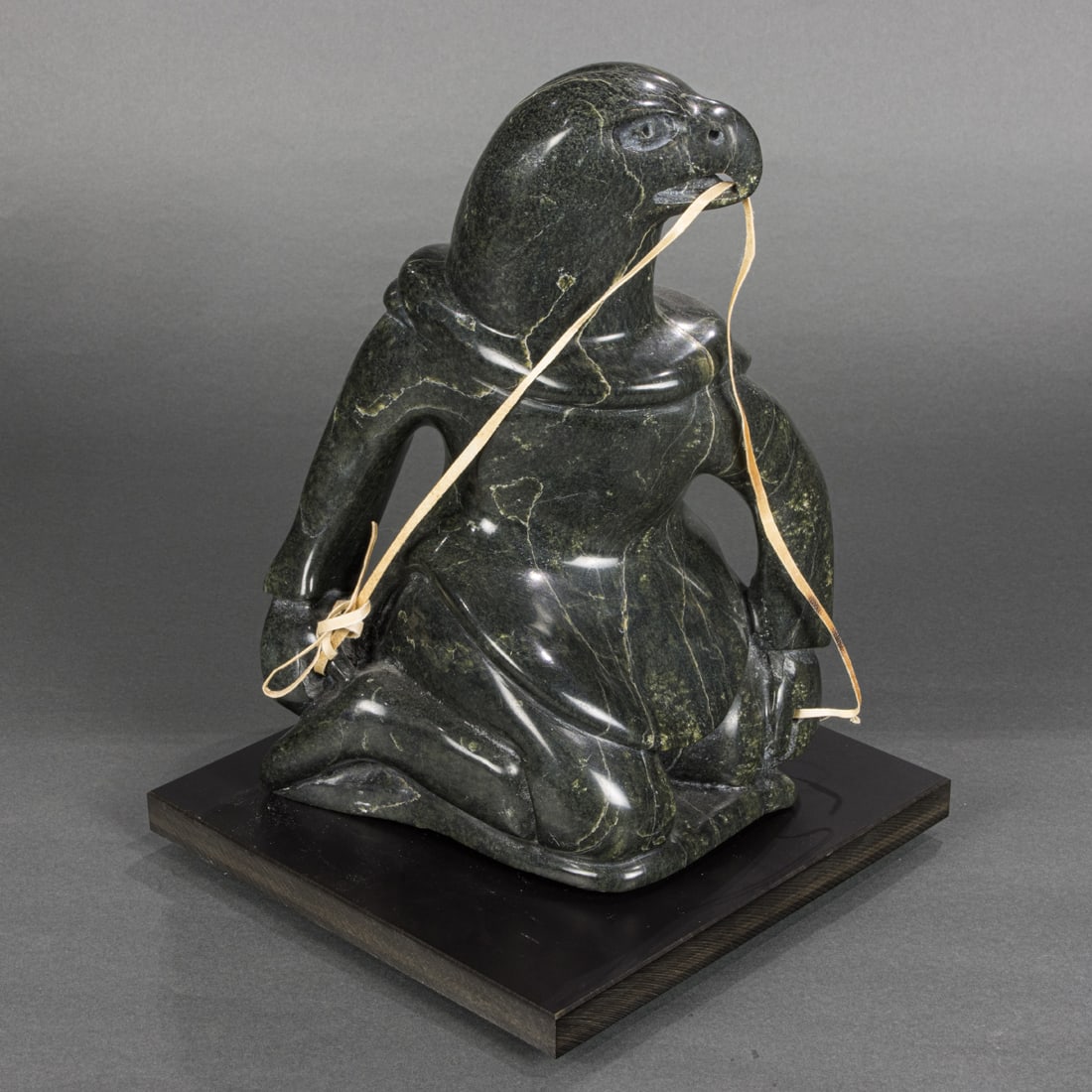 An Inuit carved stone figure of a transformation figure of eagle and human (1 of 6)