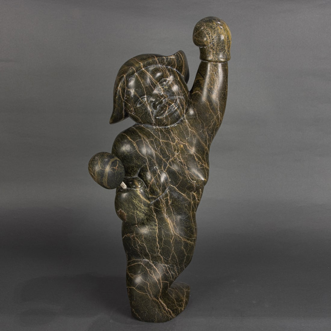 An Inuit carved stone figure of a human transforming into a seal (1 of 4)