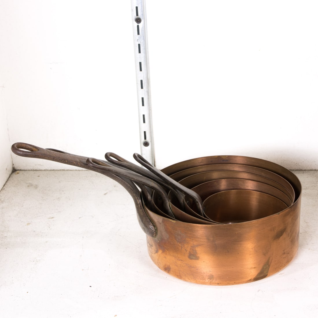 A graduated set of five copper sauce pans with iron handles (1 of 1)
