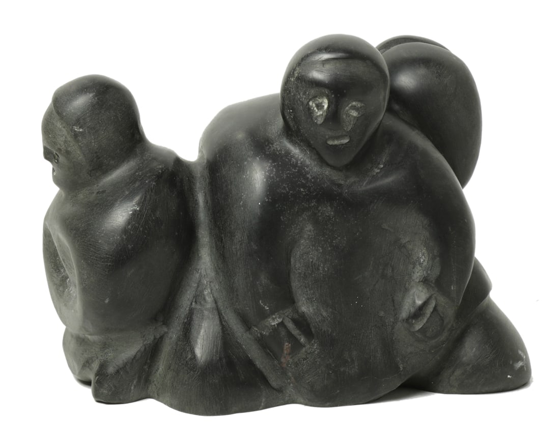 An Inuit soapstone carving of three seated figures (1 of 1)