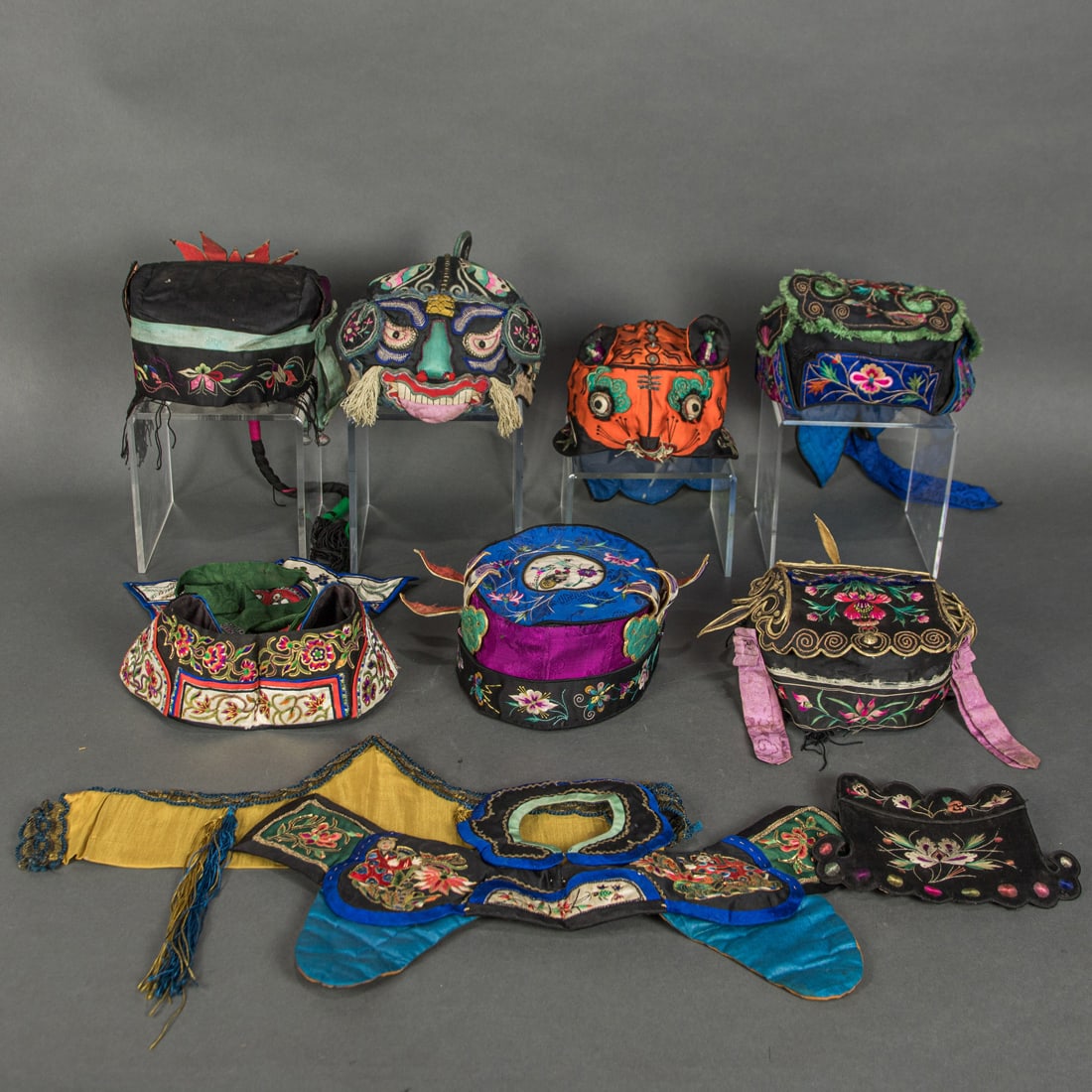 (lot of 9) Chinese embroidered children's hats: (lot of 9) Chinese embroidered children's hats. Late 19th/early 20th century, 9" long.