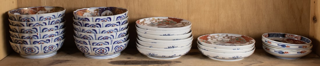 Shelf of Japanese Imari ware articles: Shelf of Japanese Imari ware articles. From 5.25" to 6.126" across.