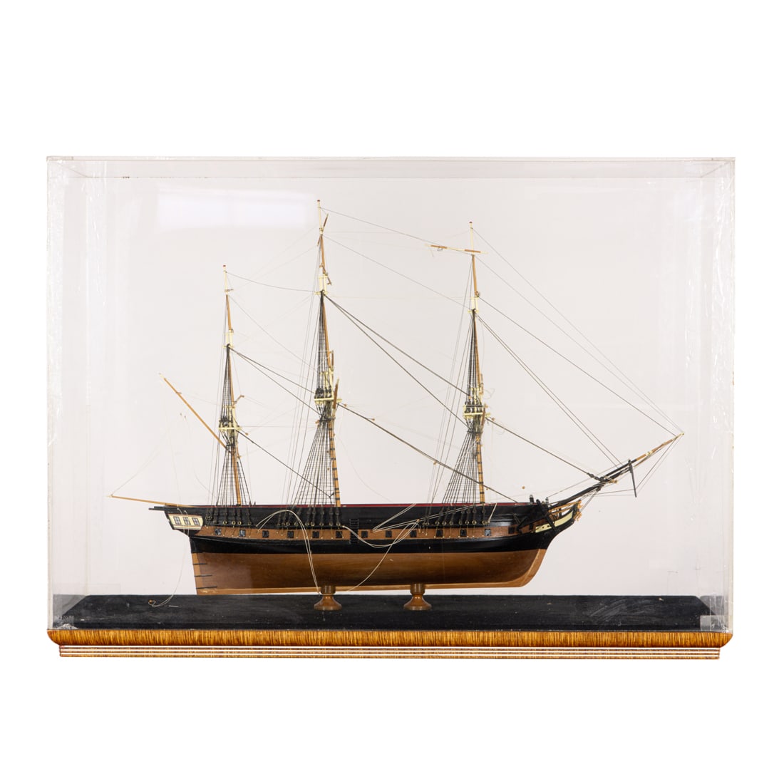 A frigate ship model of the HMS Macedonia: A frigate ship model of the HMS Macedonia, housed within glazed case, approximately 20”h x 29”w. Provenance: Estate of Meri Jaye, a renowned maritime collector and interior designer of pas