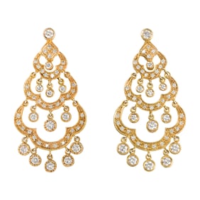 A pair of diamond and 14k gold earrings