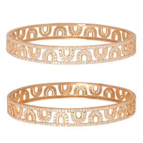 A pair of diamond and 14k gold bangle bracelets