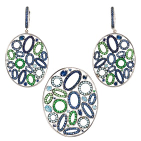 A gem-set, 18k white gold pendant and earring set