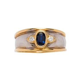 A sapphire, diamond and 18k bi-color gold ring