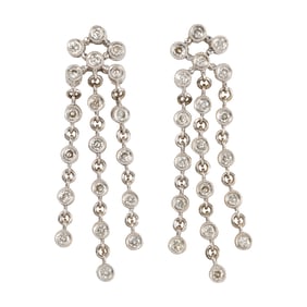 A pair of diamond and 14k white gold earrings