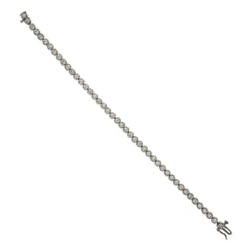 A diamond and 14k white gold tennis bracelet