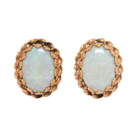 A pair of opal and 14k gold earrings