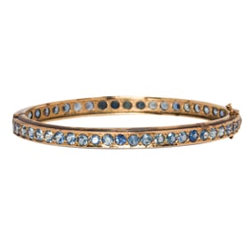 A synthetic sapphire and 10k gold bracelet