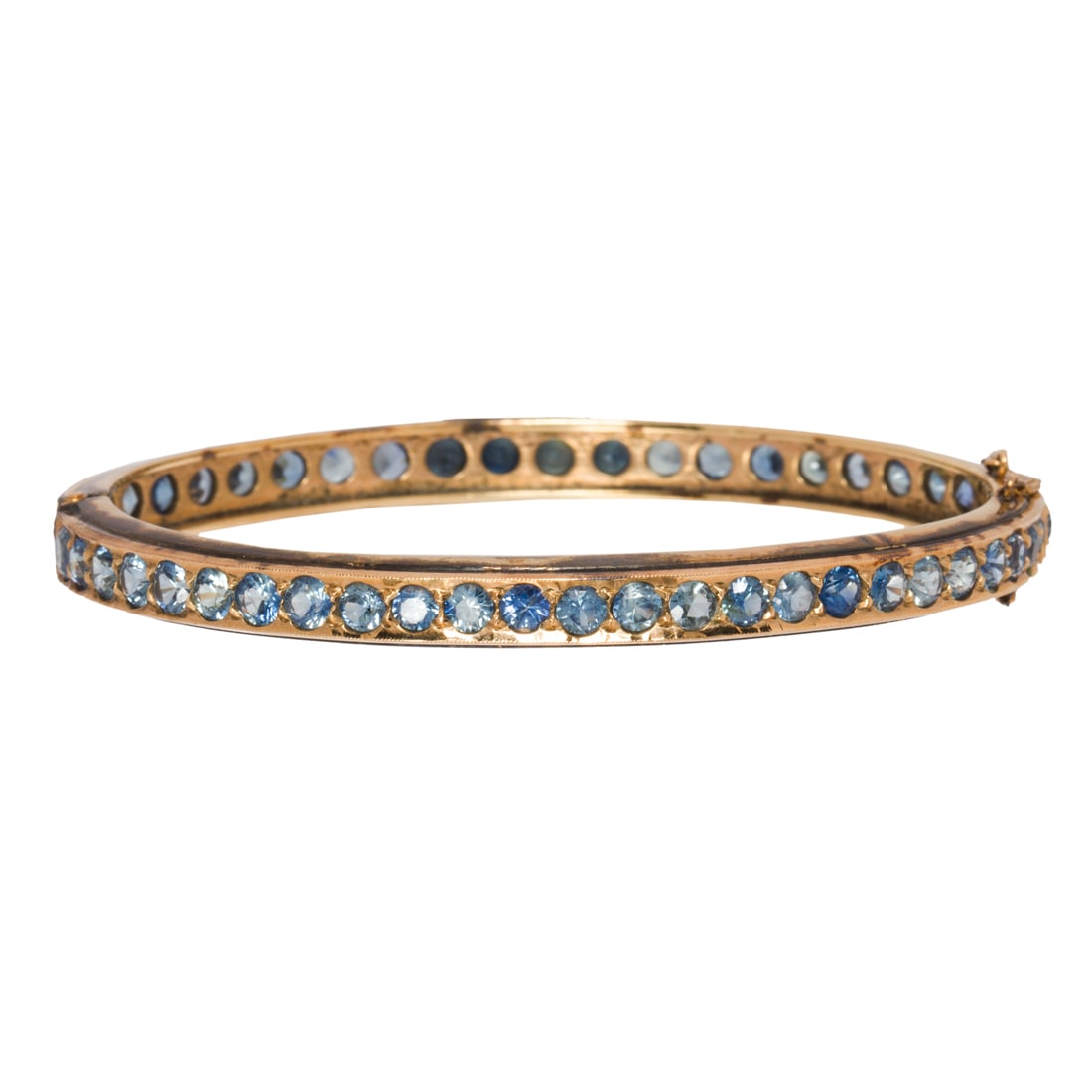 A synthetic sapphire and 10k gold bracelet (1 of 2)