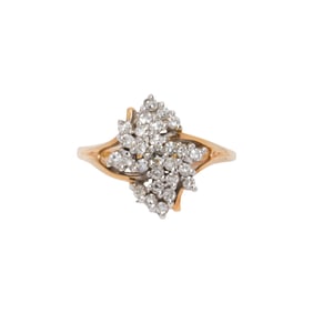 A diamond and 14k gold cluster ring