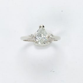 A diamond and 14k white gold ring