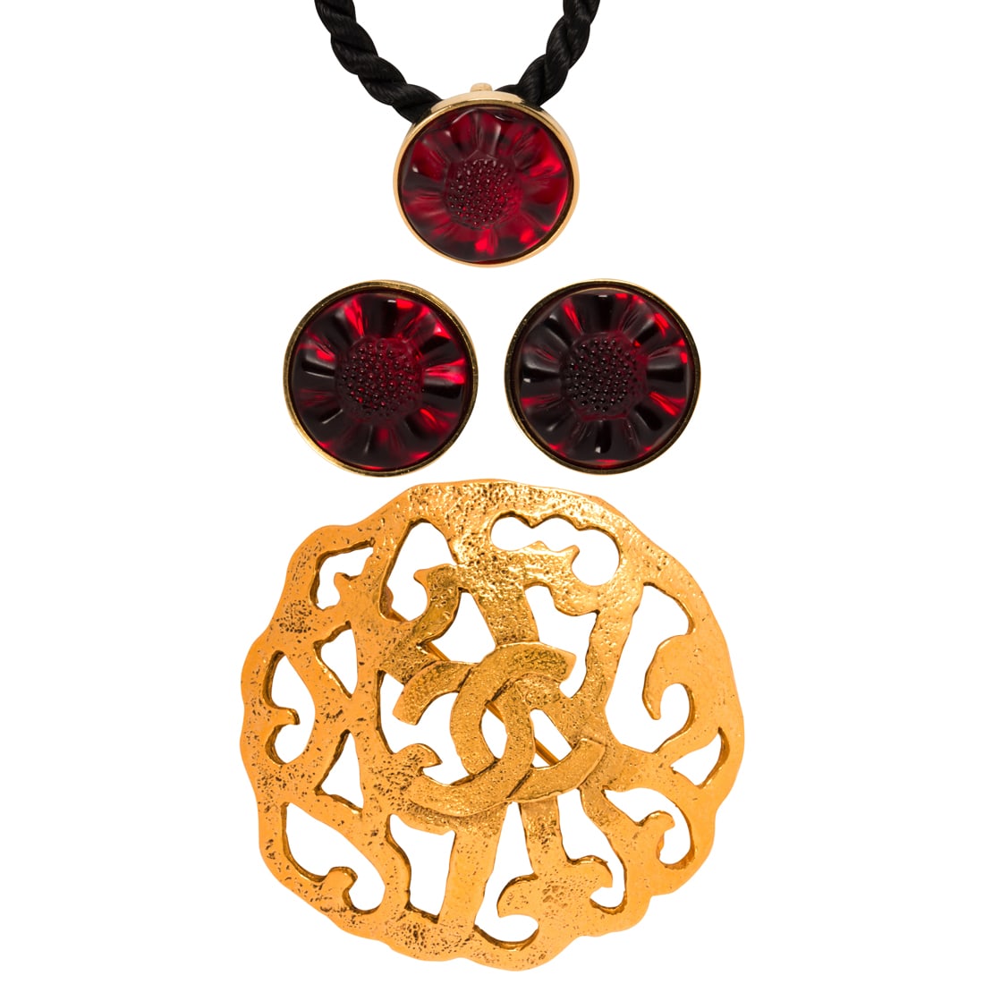 A group of designer costume jewelry: A group of designer costume jewelry comprising a Lalique stud earring and pendant necklaces suite, each designed as a bezel-set colored glass flower head; together with a Channel brooch, designed as a