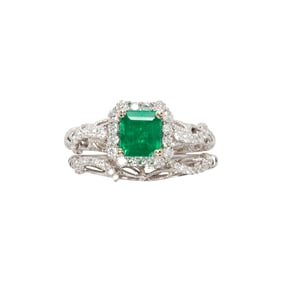 An emerald, diamond and 18k white gold engagement set