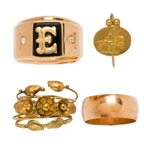 A group of gold jewelry and a yellow metal ring