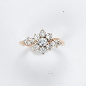 A diamond and 14k gold ring