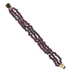 A garnet and 14k gold bracelet