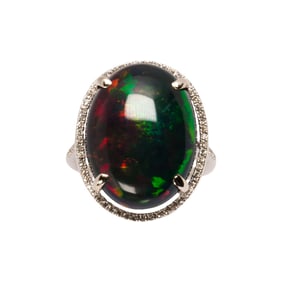 A black opal, diamond and 14k white gold ring