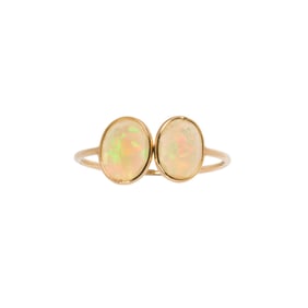 An opal and 18k gold ring