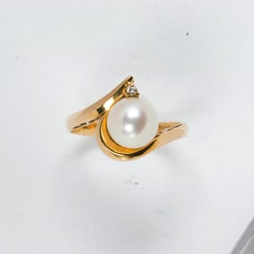 A cultured pearl and 14k gold ring and gold bracelet