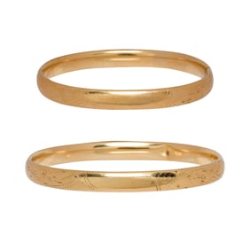 A pair of 14k gold bangles