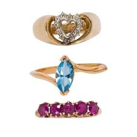 A group gemstone and gold rings