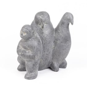 A large Inuit soapstone figural group of a man with two standing birds, Tona Iquilik, Baker Lake