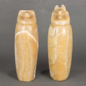 An associated pair of Egyptian banded alabaster canopic jars, possibly Late Period,