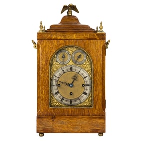 An Edwardian gilt bronze mounted oak bracket clock