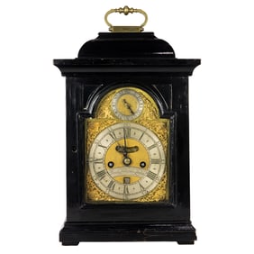 A George II gilt brass mounted ebonized wood bracket clock