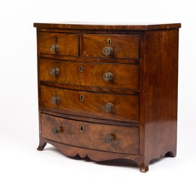 A Geroge III style mahogany miniature chest of drawers